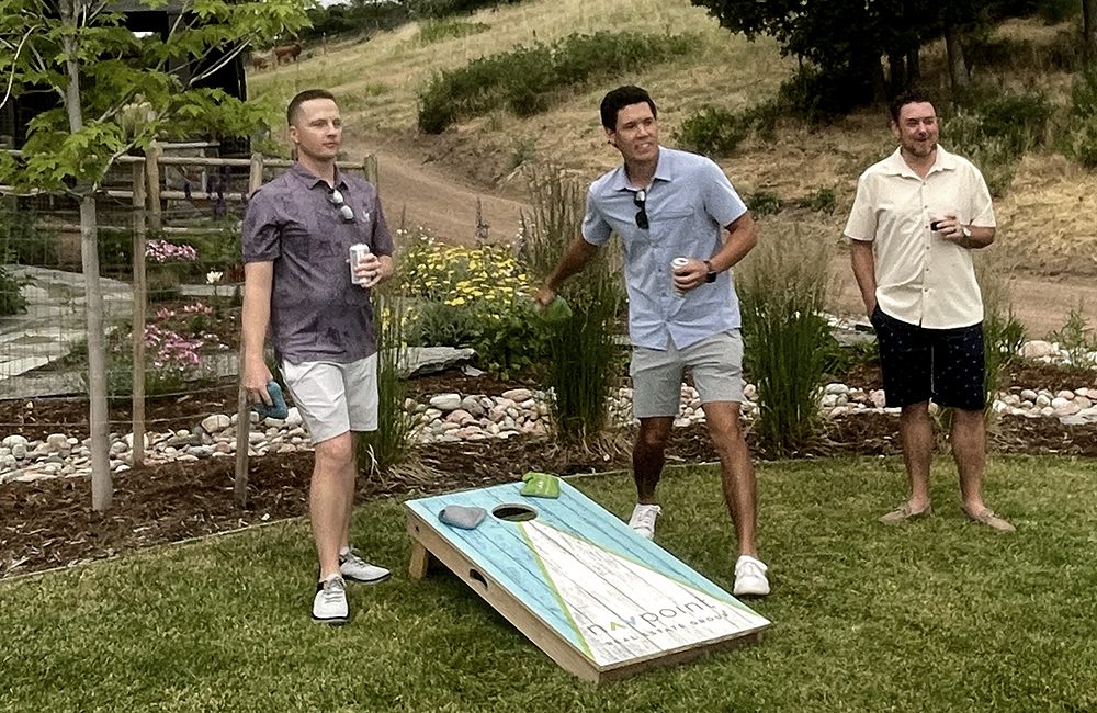 NavPoint team plays cornhole