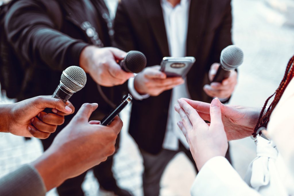 Press reports conducting an interview